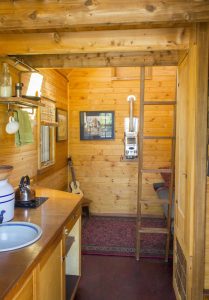Dee's Kozy Kabin Tiny House Entry and Living Area Vertical View