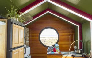 The kitchen and porthole window to the Alvord Desert